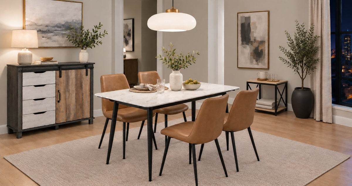 A dining room with a white sintered stone Eclipse table and four camel chairs, an Avenbury barn-door sideboard and a Penny side table