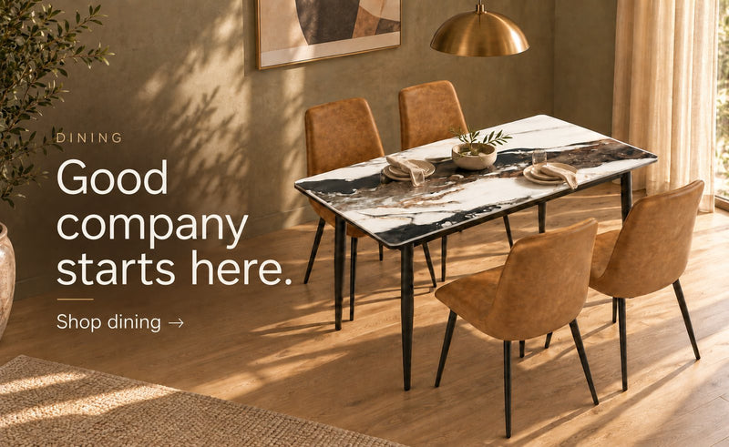 A marble-top dining table with four tan chairs: Good company starts here